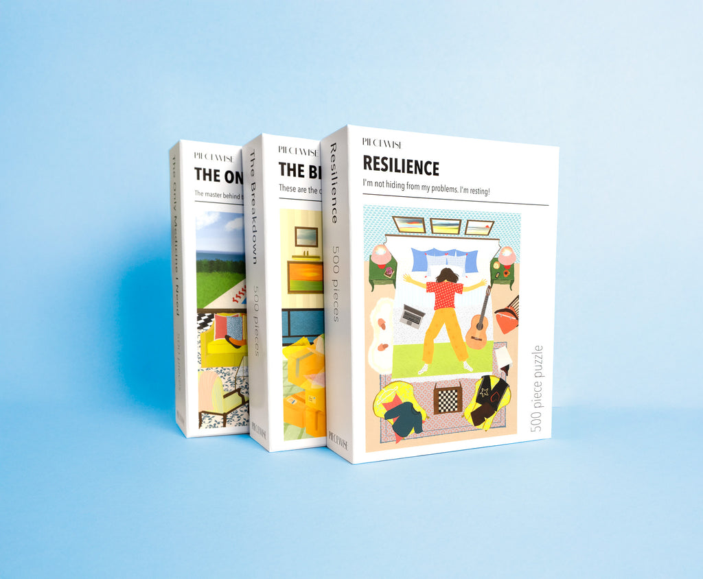 Three puzzle boxes with colorful illustrations on a light blue background