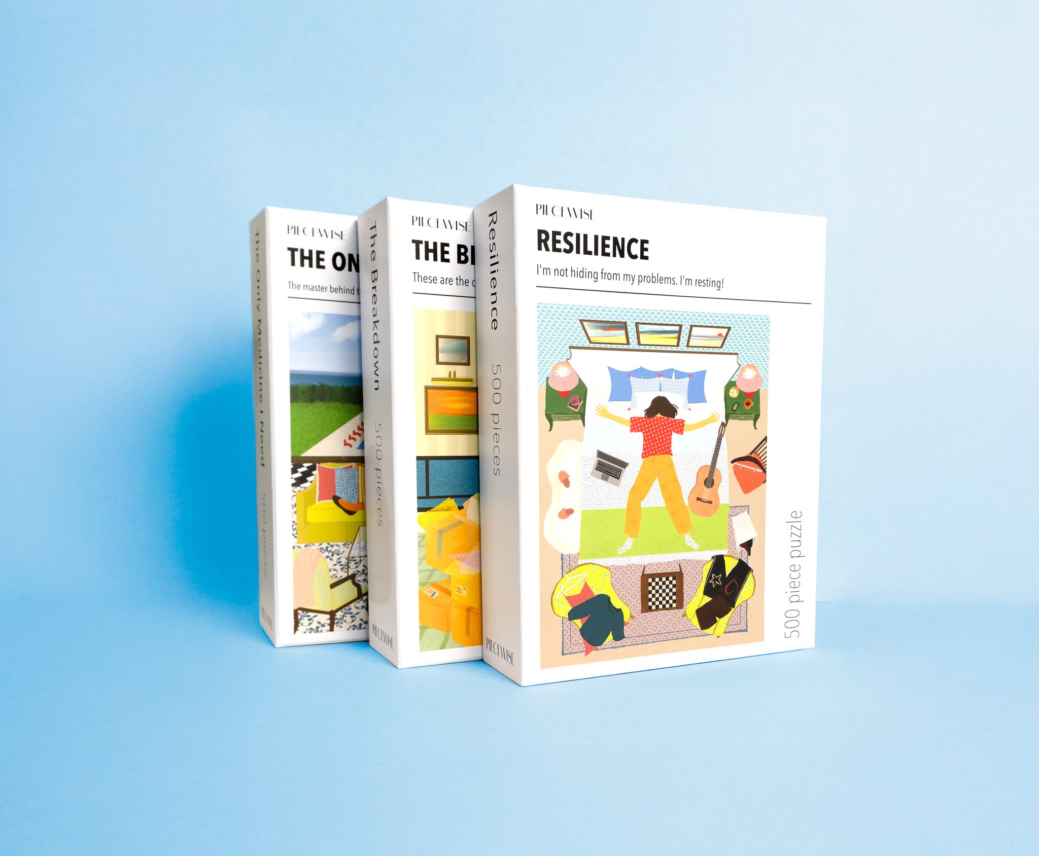 Three puzzle boxes with colorful illustrations on a light blue background